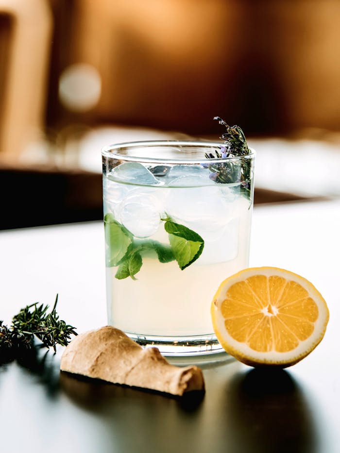 services-03 Cold cocktail with lemon, herbs, ginger, ideal for summer refreshment.